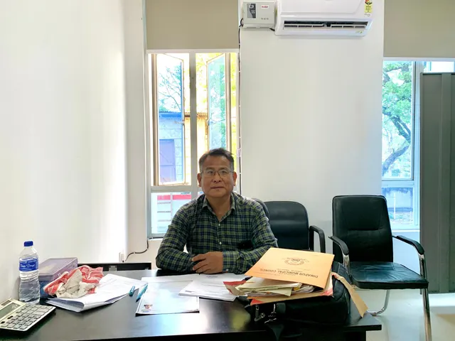 An officer at a desk in the council office